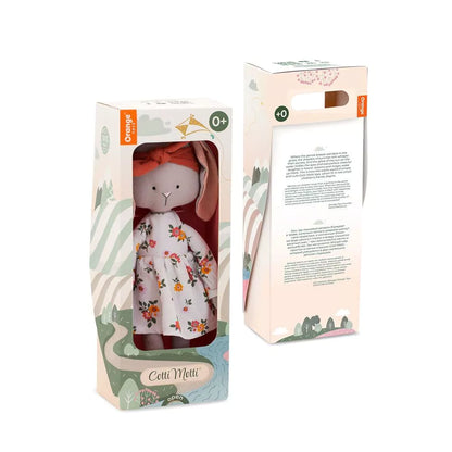 Peluche Lucy le Lapin Cotti Motti avec robe florale et bandeau rouge, présentée dans un coffret cadeau, disponible sur Pitamoon